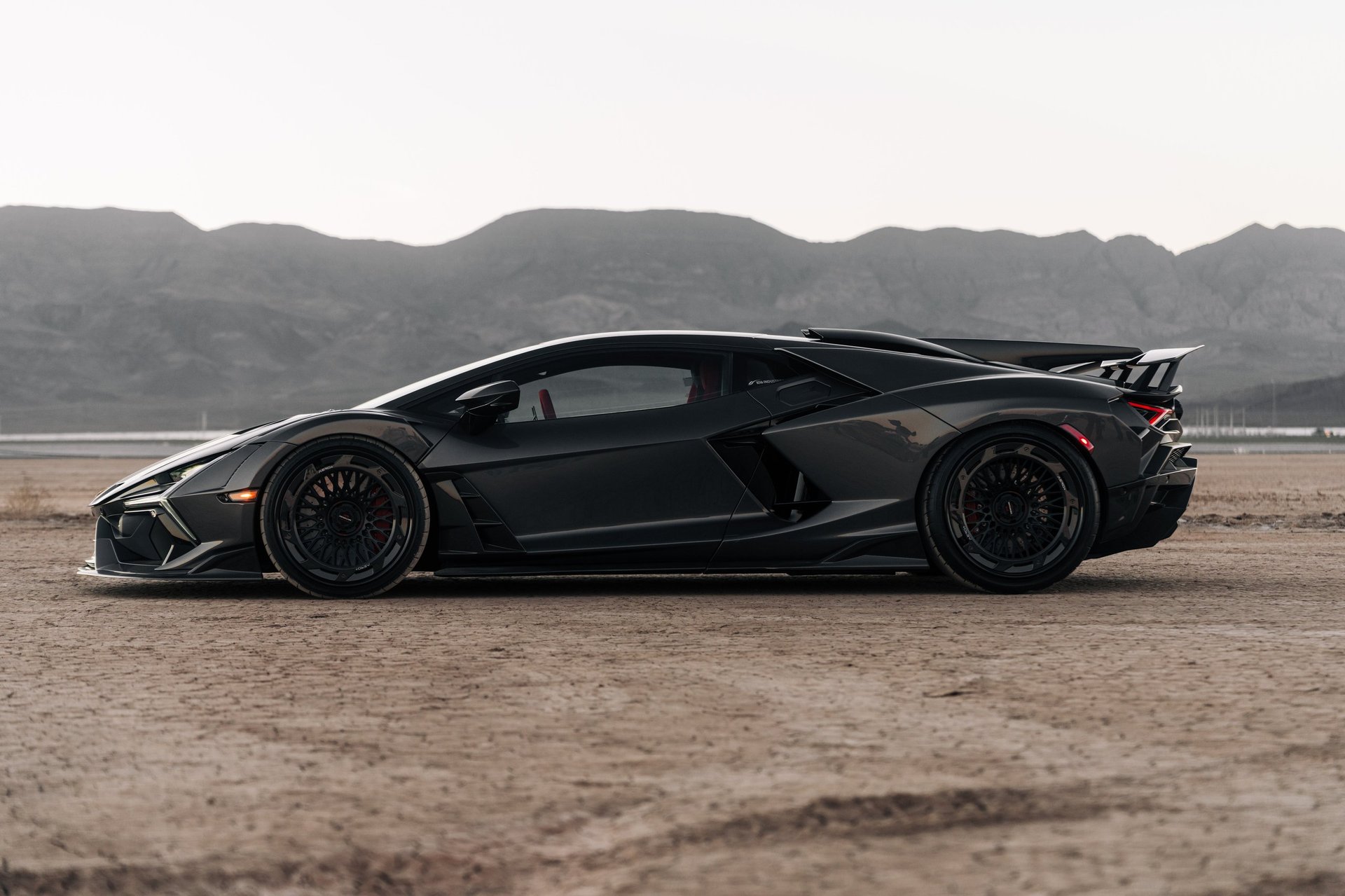 Black Lamborghini Revuelto parked in desert